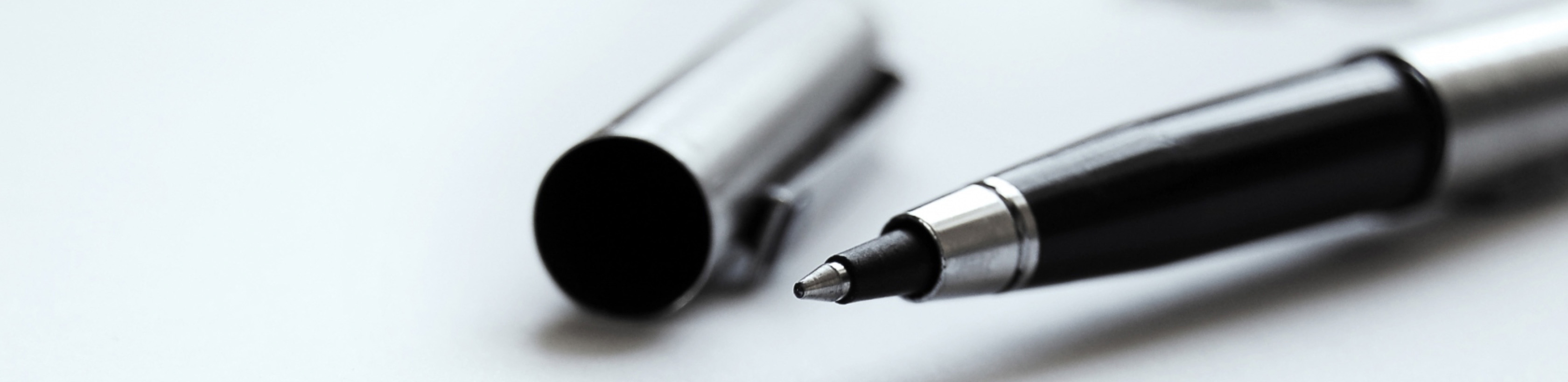 Close-up of open pen and pen cap